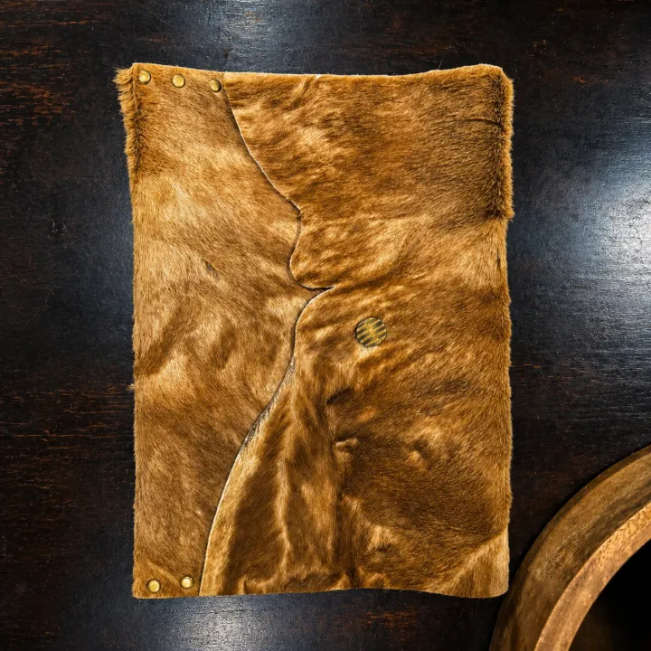 Nkosi — tan hide sleeve with center seam